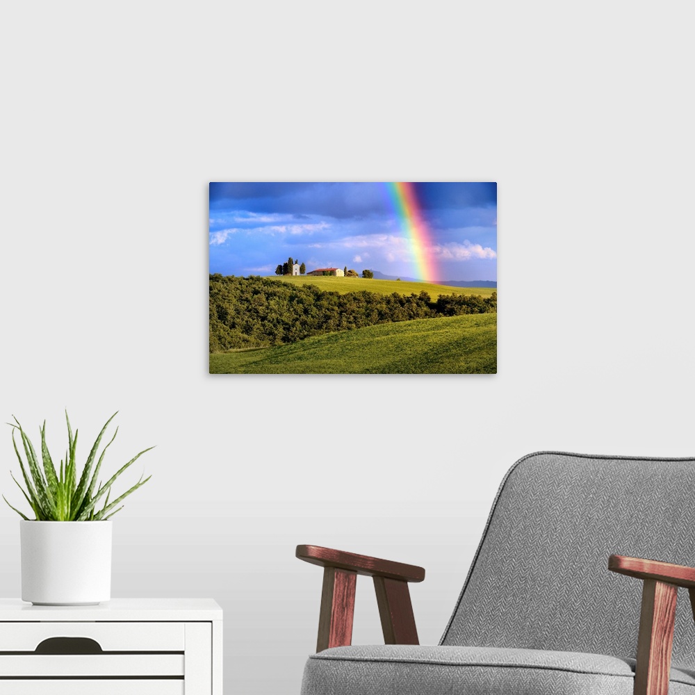 A modern room featuring Italy, Tuscany, Siena district, Orcia Valley, the Chapel of Vitaleta with a rainbow over it.