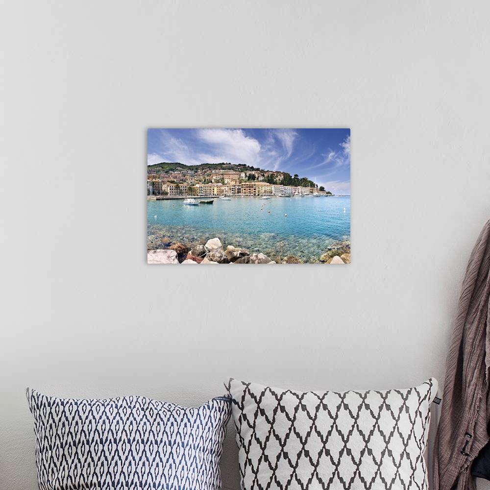A bohemian room featuring Italy, Tuscany, Porto Santo Stefano, view towards the town and the harbour