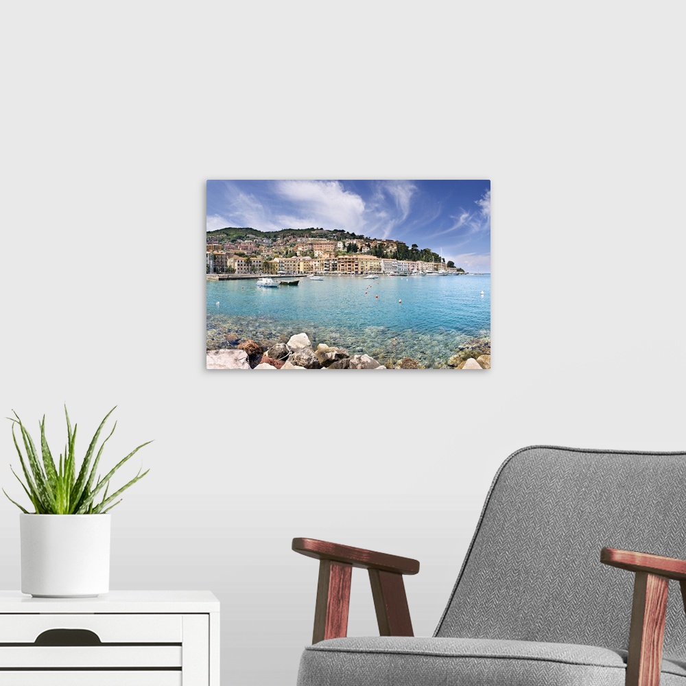A modern room featuring Italy, Tuscany, Porto Santo Stefano, view towards the town and the harbour