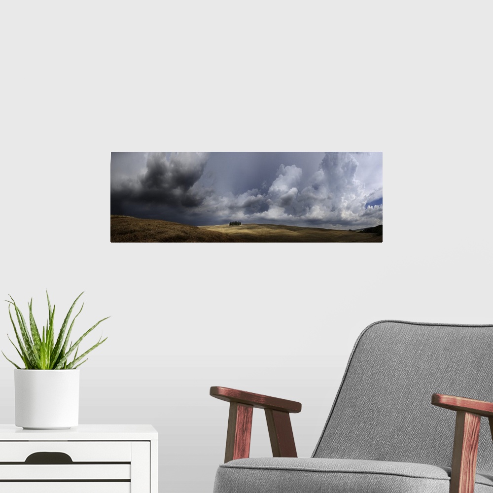 A modern room featuring Italy, Tuscany, San Quirico d'Orcia, Storm over group of cypress trees.