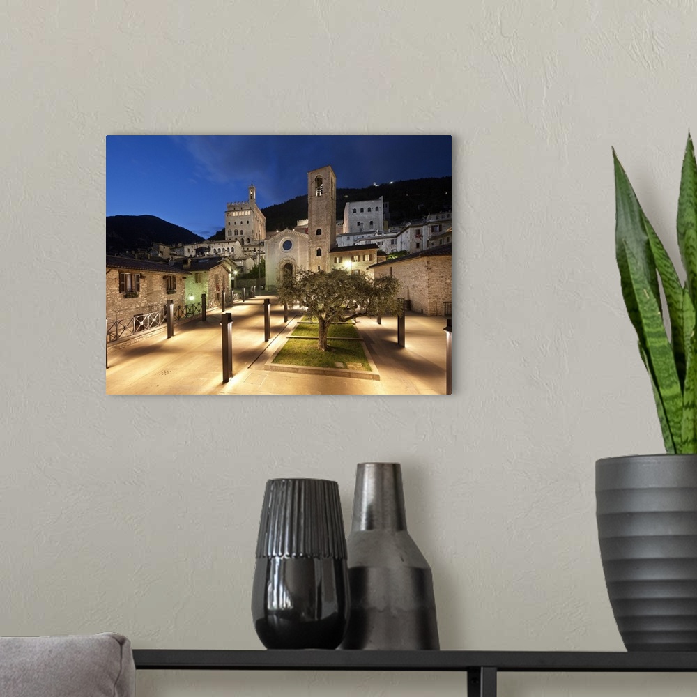 A modern room featuring Italy, Umbria, Mediterranean area, Perugia district, Gubbio, View of Piazza San Giovanni with San...