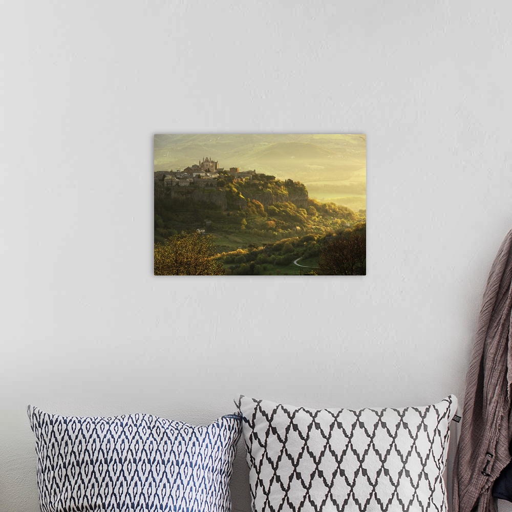 A bohemian room featuring Italy, Umbria, Terni district, Orvieto, Cathedral and the surrounding area at sunrise.