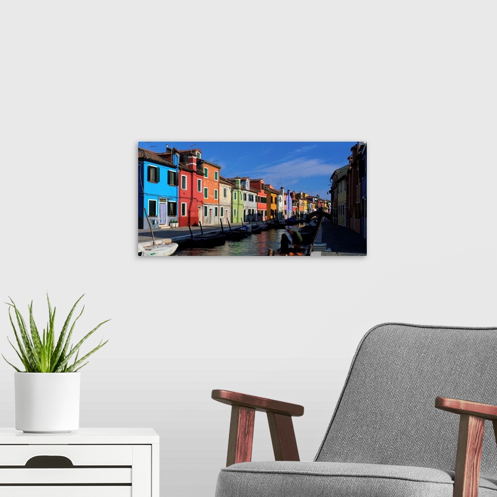 A modern room featuring Italy, Venice, Burano, houses along canal
