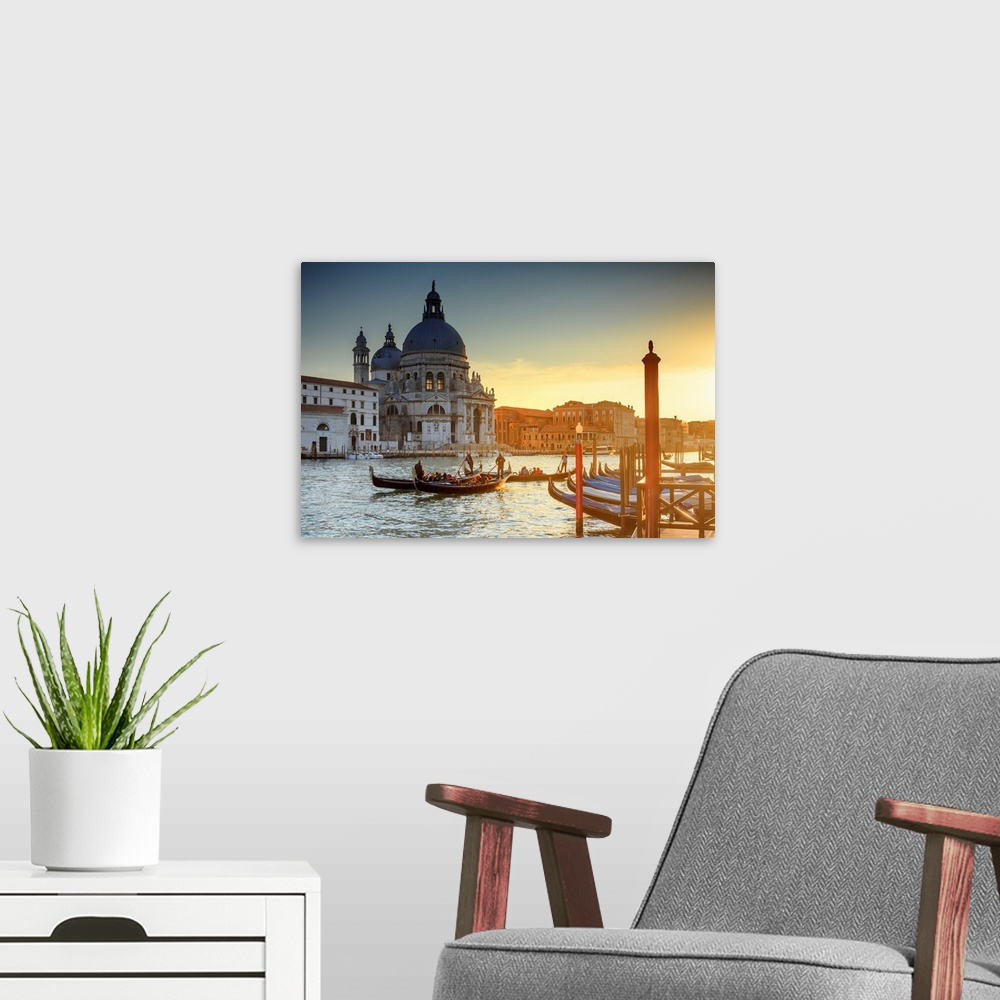 A modern room featuring Italy, Venice, Gondolas and the Santa Maria della Salute church at sunset.
