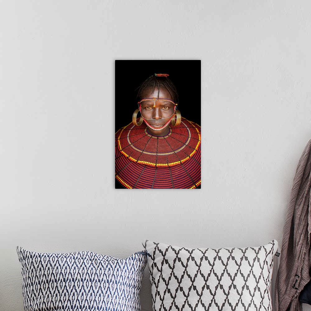 A bohemian room featuring Kenya, Central, Pokot girl in traditional clothing.