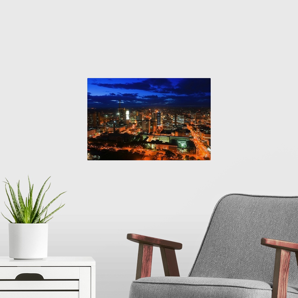 A modern room featuring Kenya, Nairobi Area, Nairobi, City skyline at dusk