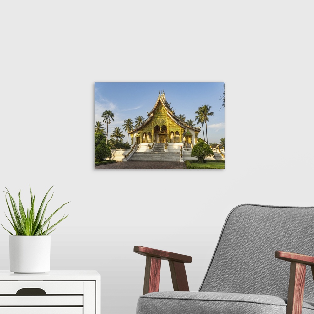 A modern room featuring Laos, North Region, Luang Prabang, The intricately adorned facade of Wat Haw Pha Bang temple in L...