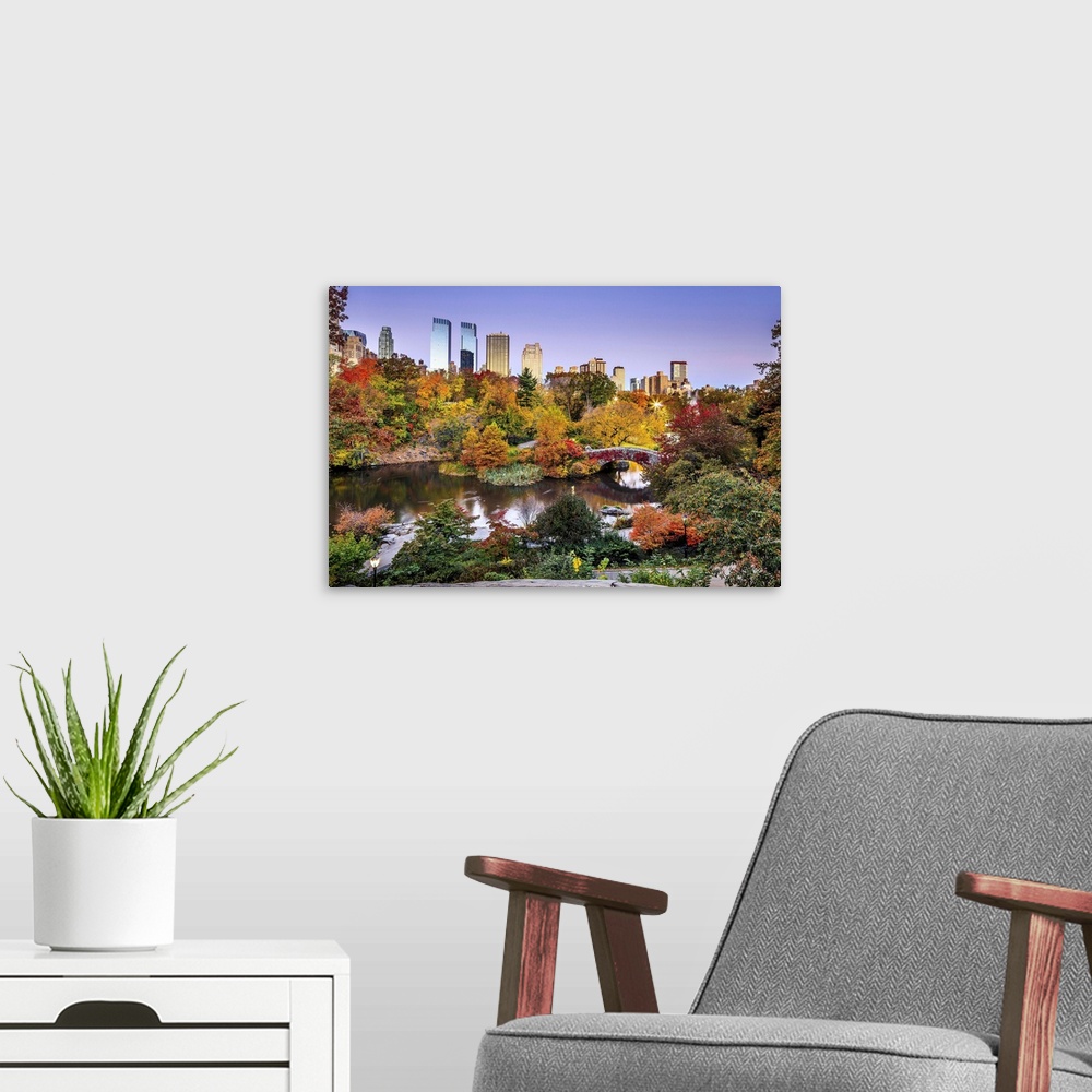A modern room featuring USA, New York City, Manhattan, Central Park, Midtown skyline and Gapstow Bridge during the foliage