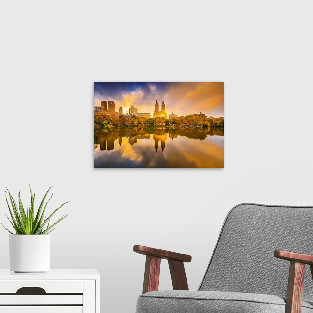 A modern room featuring USA, New York City, Manhattan, Central Park, The lake and San Remo apartment building, foliage