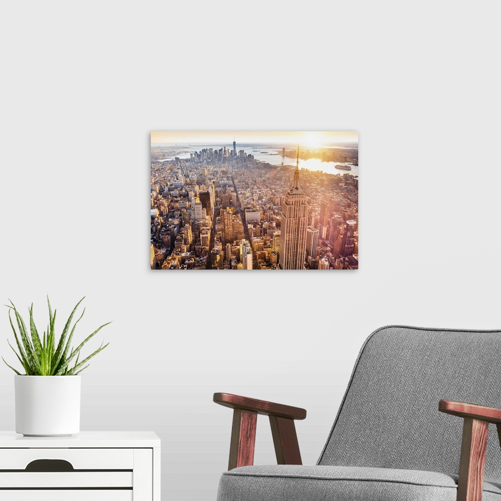 A modern room featuring USA, New York City, Manhattan, Midtown, Aerial view towards Empire State Building and One World T...
