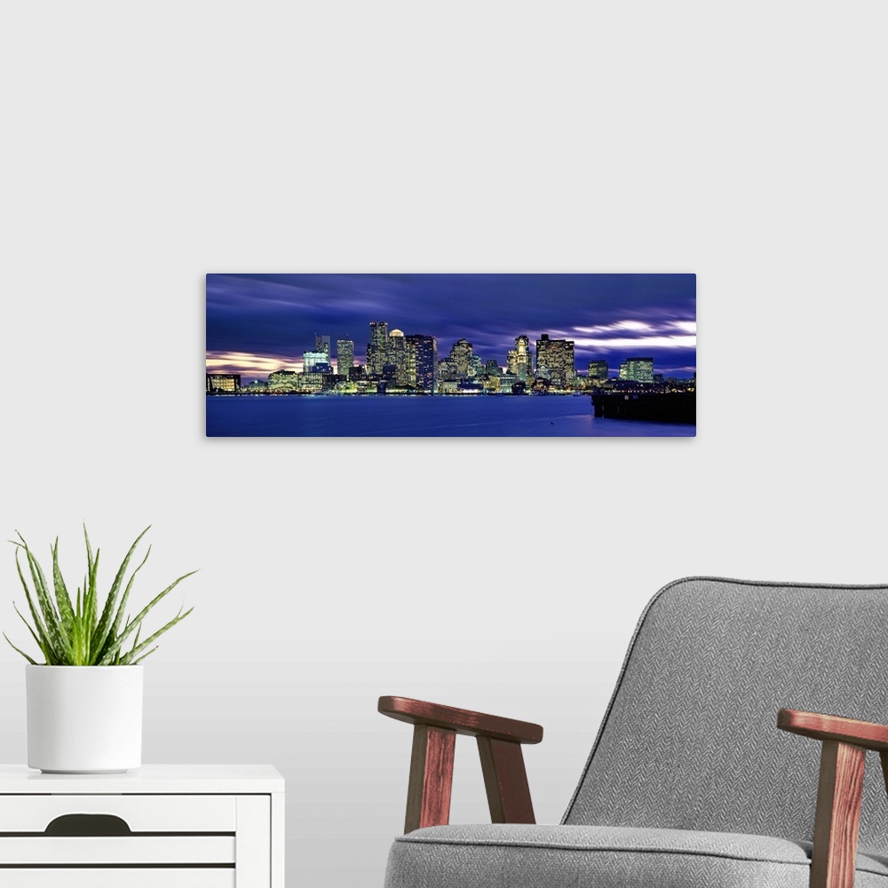 A modern room featuring Massachusetts, New England, Boston, View of the skyline at sunset