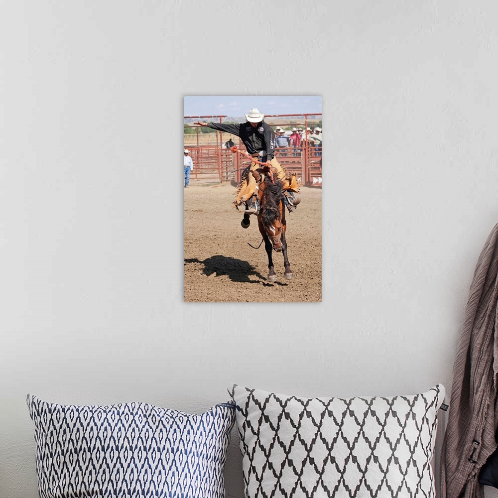 A bohemian room featuring Montana, Crow Agency, Bronco riding during the All Indian Rodeo at the Annual Crow Fair