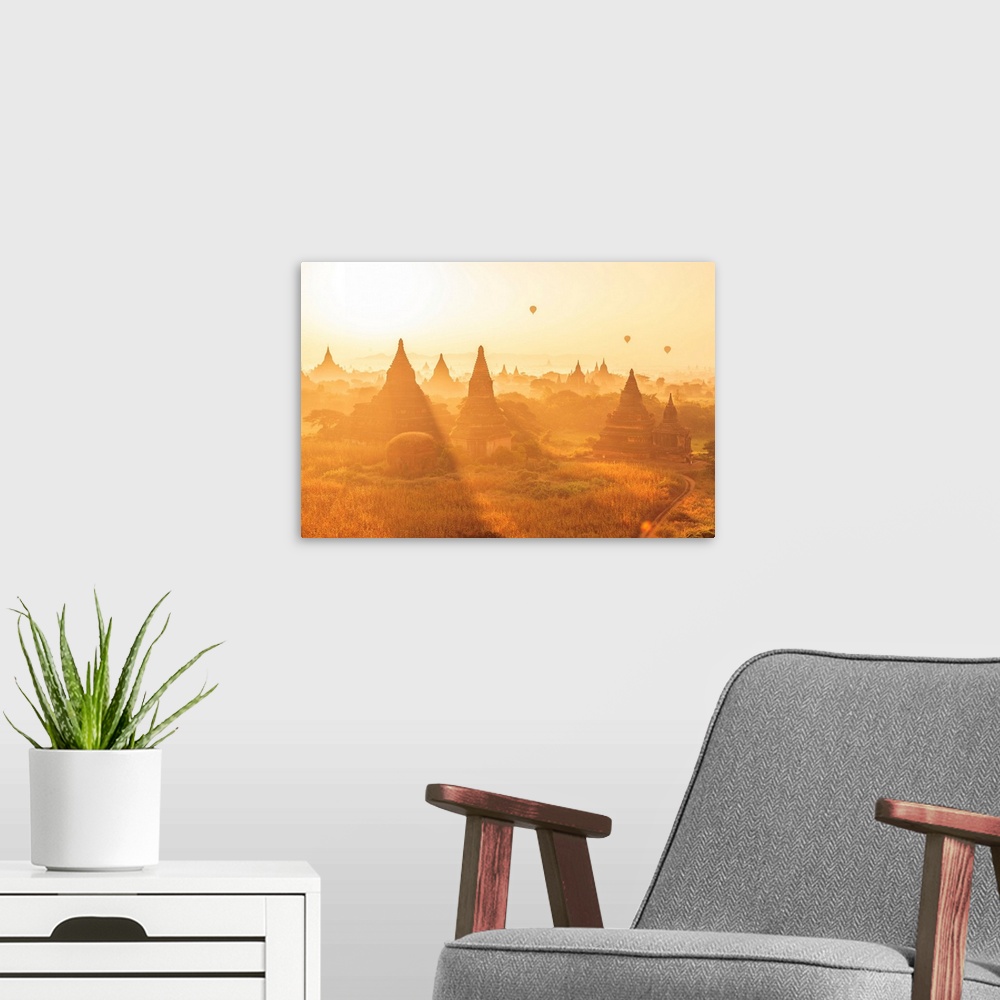 A modern room featuring Myanmar, Mandalay, Bagan, Hot air balloons at sunrise over Bagan, ancient city located in the Man...