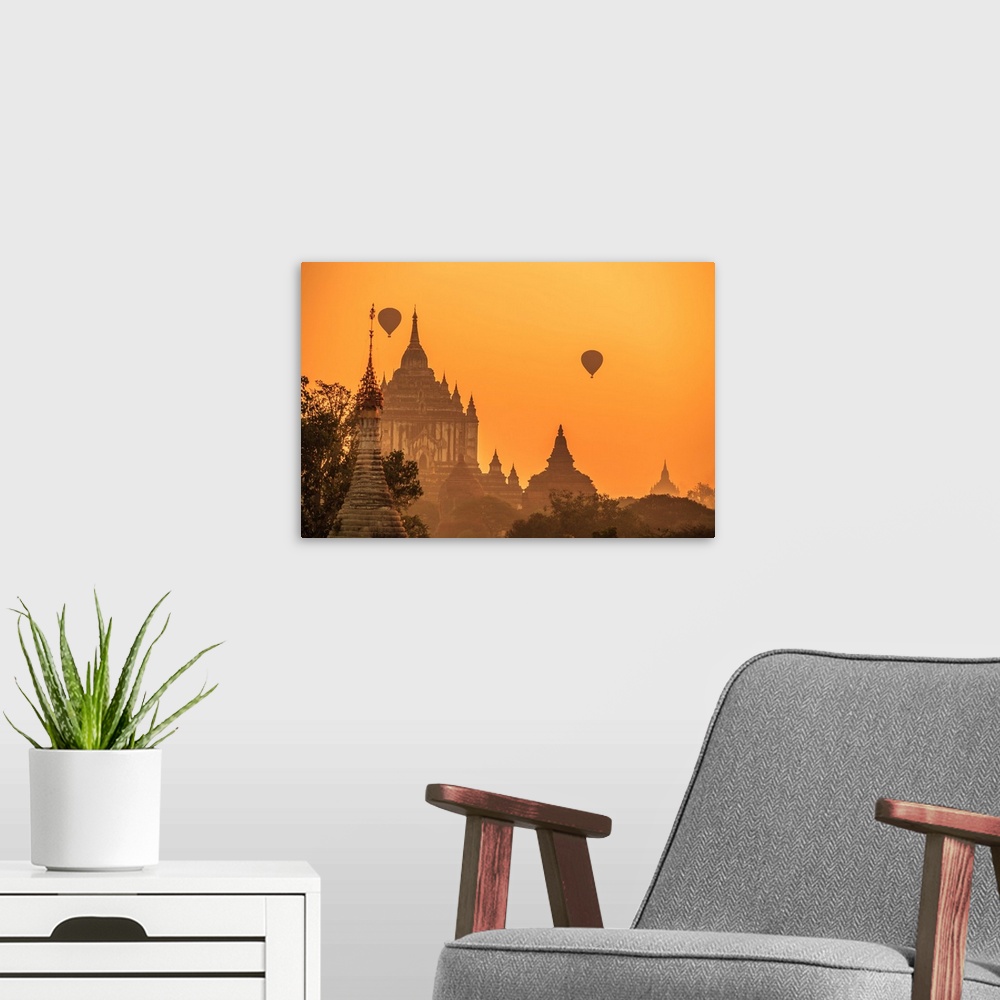 A modern room featuring Myanmar, Mandalay, Bagan, Hot air balloons over Gawdawpalin Temple at sunrise. This is the second...