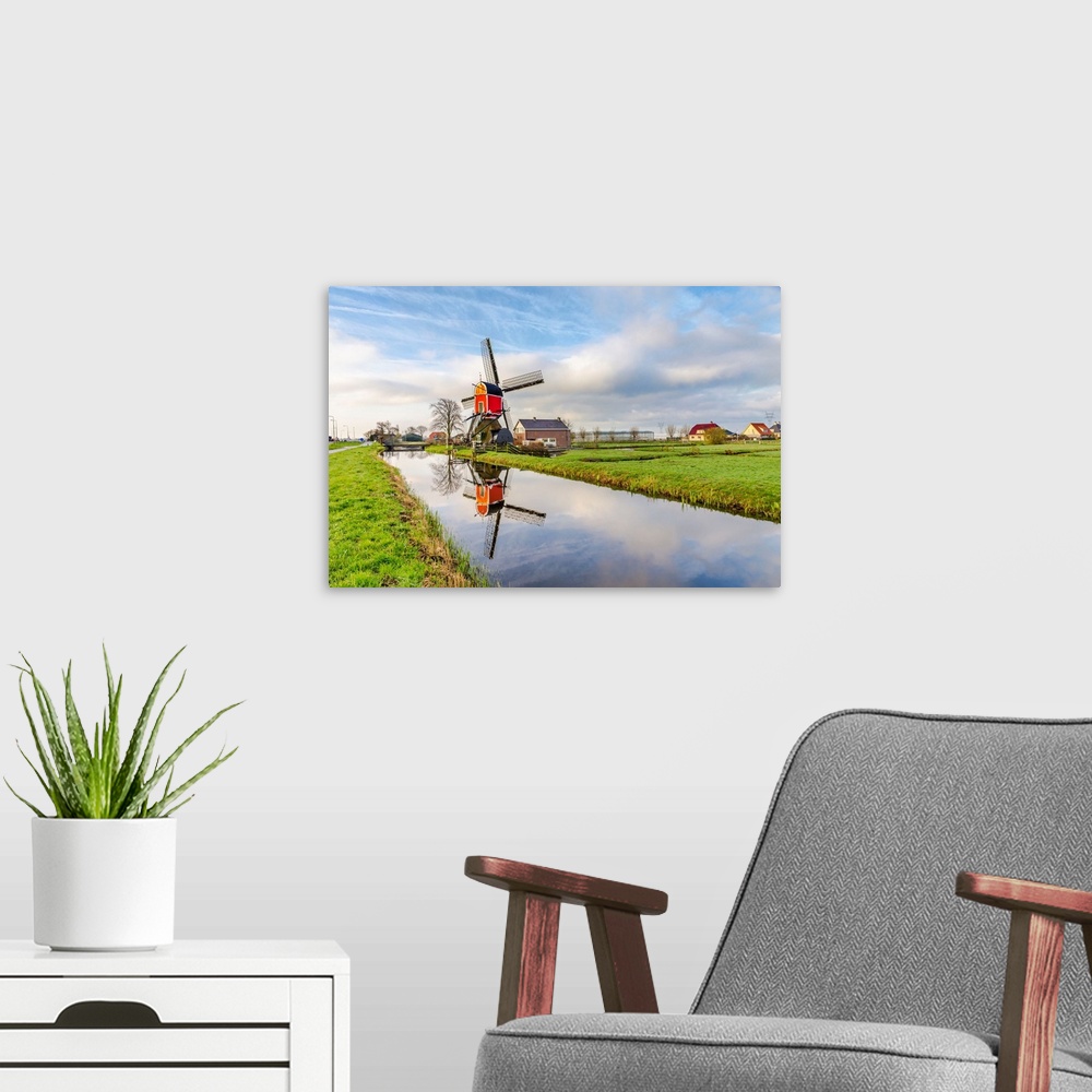 A modern room featuring Netherlands, North Holland, Benelux, Hoorn, Windmill on a thatched house in the countryside.