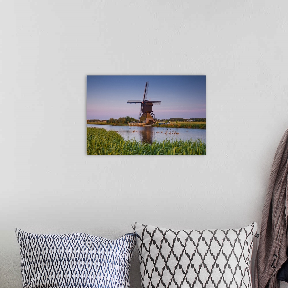 A bohemian room featuring Netherlands, South Holland, Benelux, Kinderdijk, Windmill, evening.