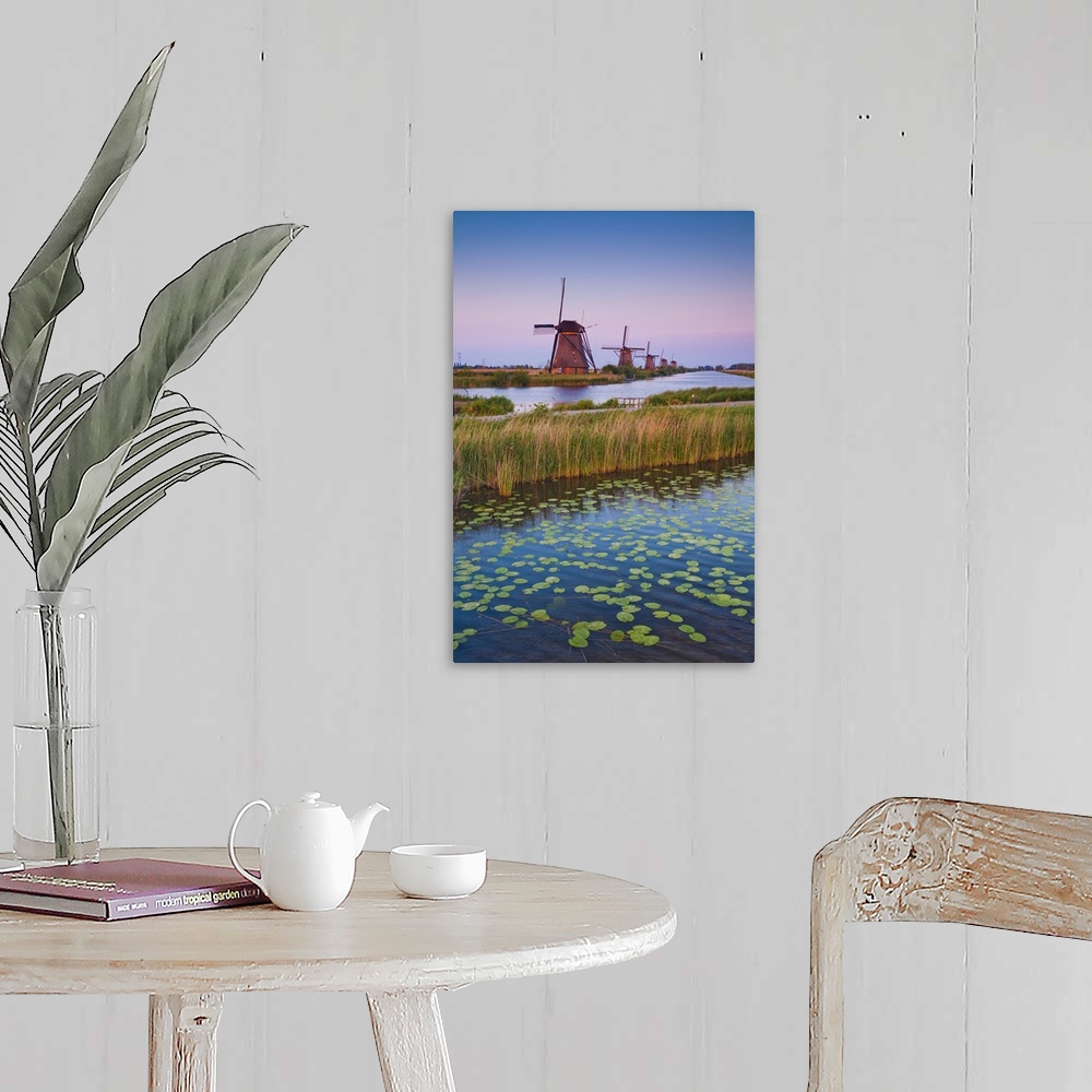 A farmhouse room featuring Netherlands, South Holland, Benelux, Kinderdijk, Windmill, evening.