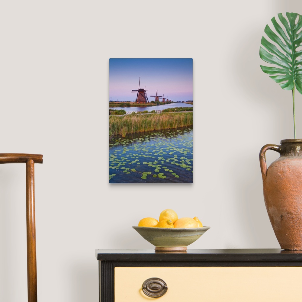 A traditional room featuring Netherlands, South Holland, Benelux, Kinderdijk, Windmill, evening.
