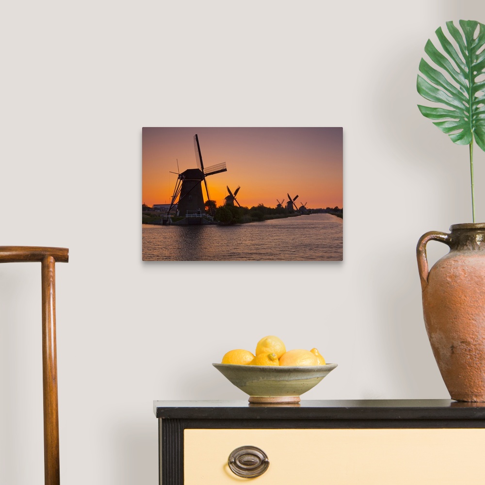A traditional room featuring Netherlands, South Holland, Benelux, Kinderdijk, Windmills at sunset.