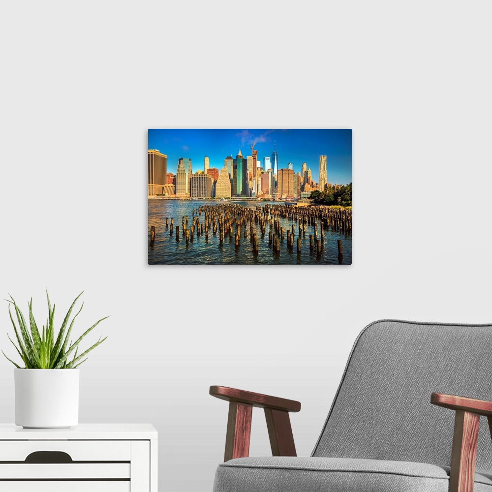 A modern room featuring New York City, Brooklyn, Brooklyn Bridge Park, wooden piles, Lower Manhattan Financial District s...