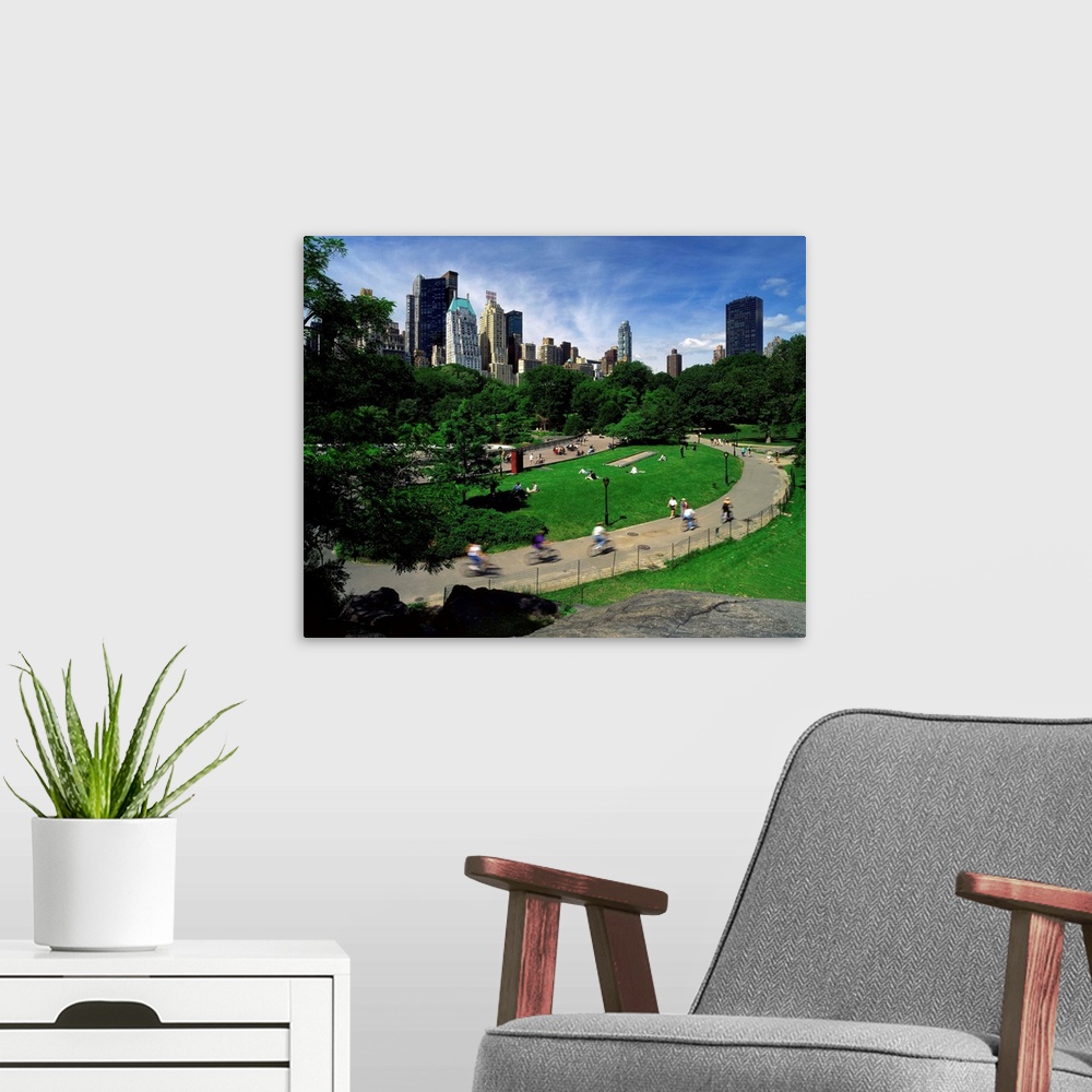 A modern room featuring New York City, Central Park, bicycle riders