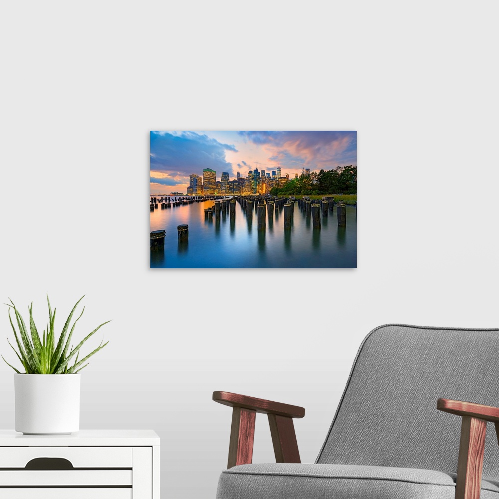 A modern room featuring New York City, Downtown skyline seen from Brooklyn.