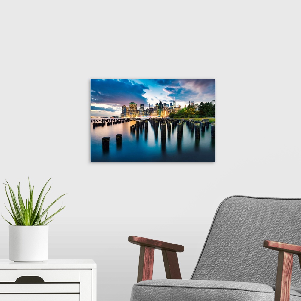 A modern room featuring New York City, Downtown skyline seen from Brooklyn.