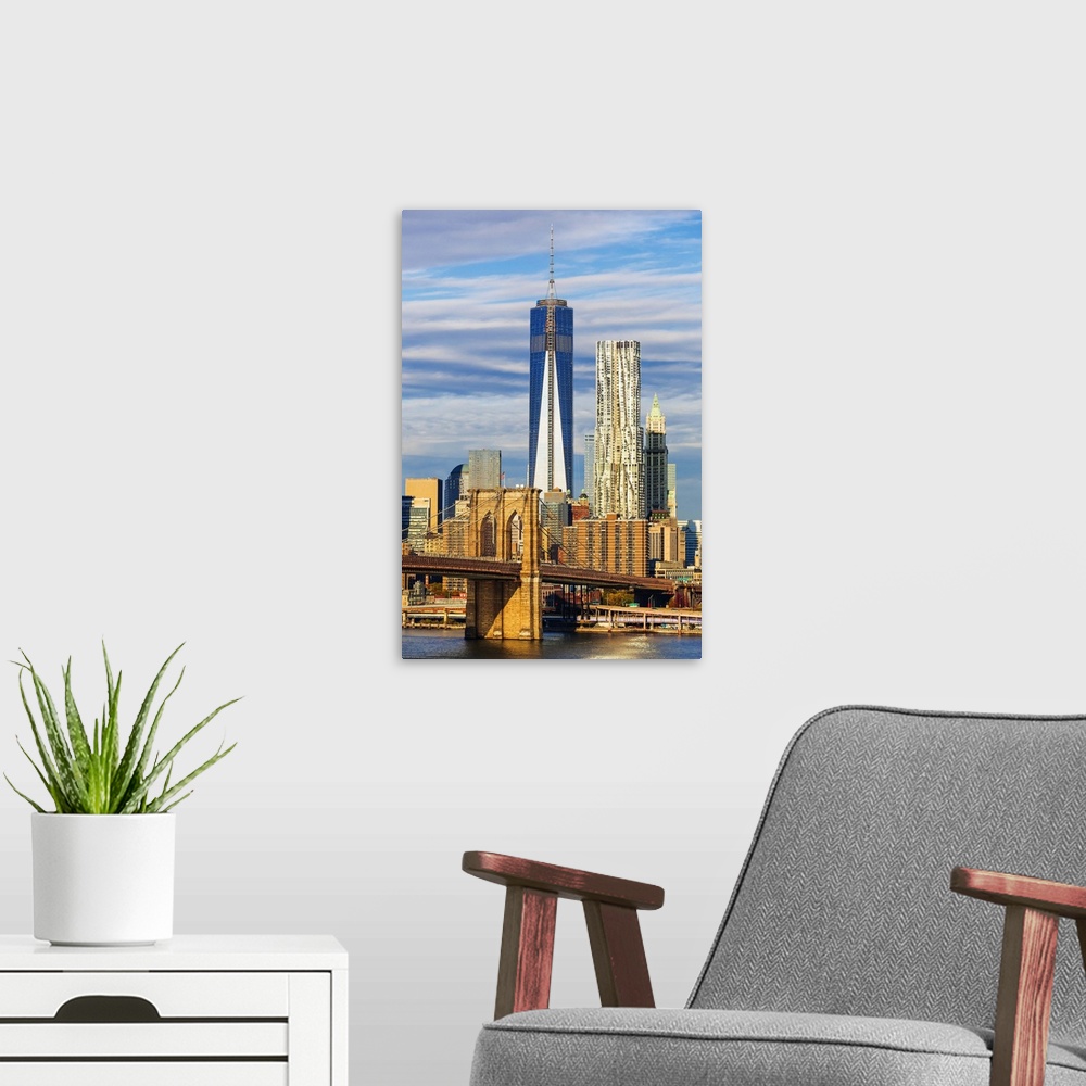 A modern room featuring USA, New York City, East River, Manhattan, Brooklyn Bridge, The bridge with the Freedom Tower in ...