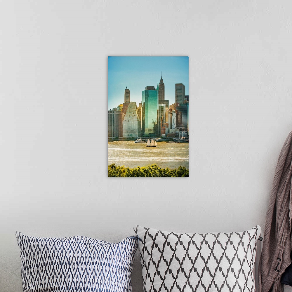 A bohemian room featuring New York City, Lower Manhattan financial district and sailboat viewed from Brooklyn..