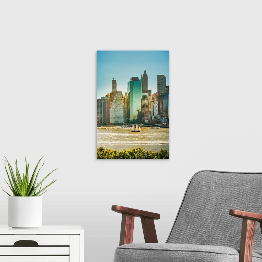 A modern room featuring New York City, Lower Manhattan financial district and sailboat viewed from Brooklyn..