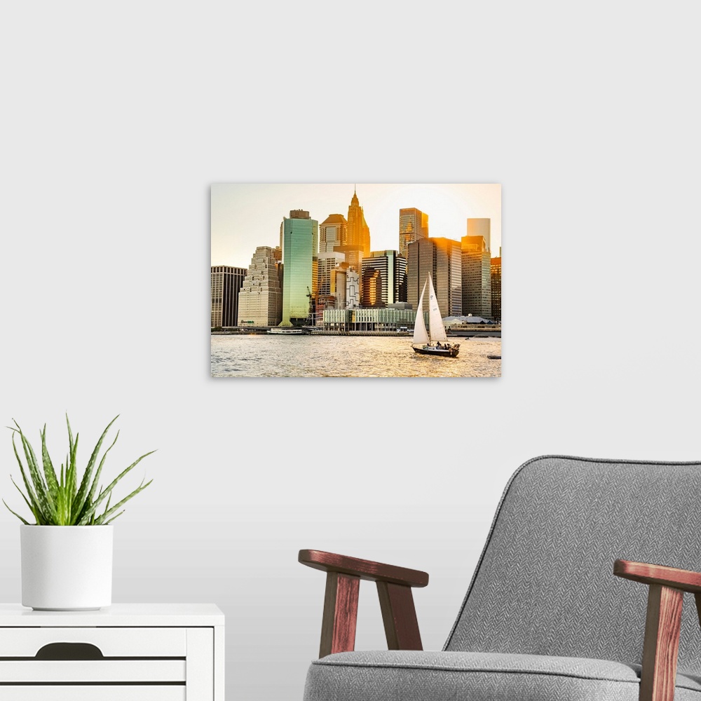 A modern room featuring New York City, Lower Manhattan financial district and sailboat viewed from Brooklyn..