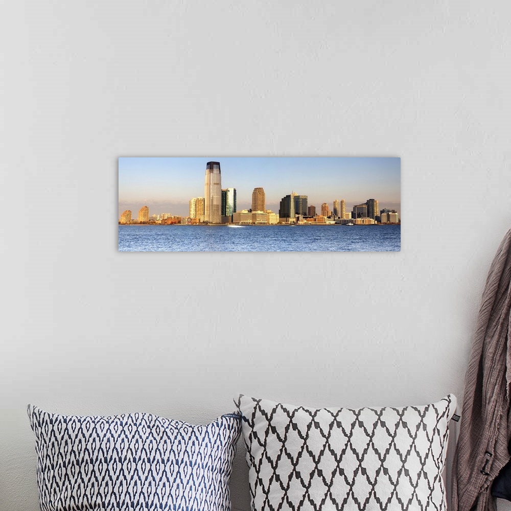 A bohemian room featuring USA, New York City, Manhattan, Lower Manhattan, Jersey Skyline at dawn, view from South Cove Park.