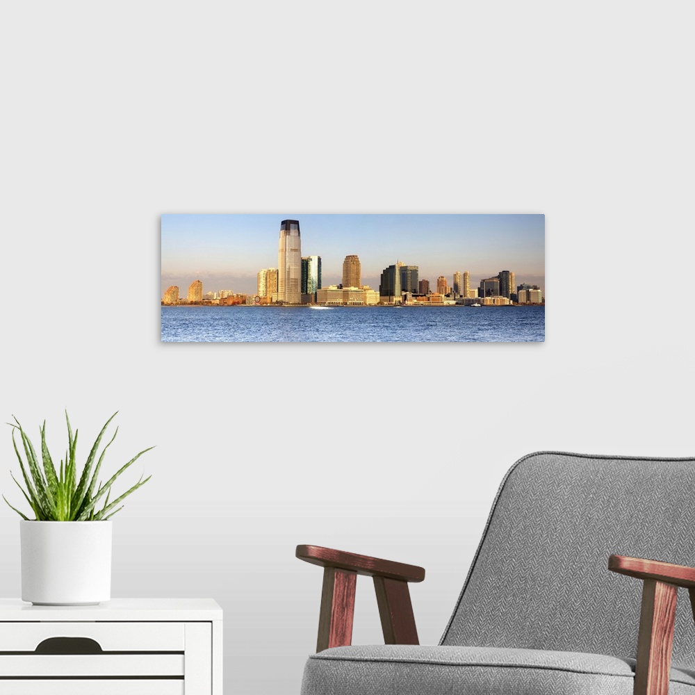 A modern room featuring USA, New York City, Manhattan, Lower Manhattan, Jersey Skyline at dawn, view from South Cove Park.