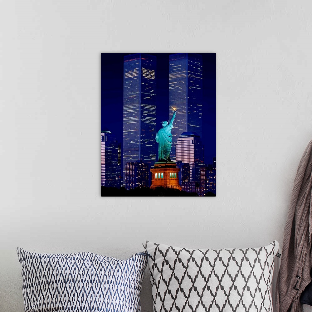 A bohemian room featuring New York City, Statue of Liberty and World Trade Center at night