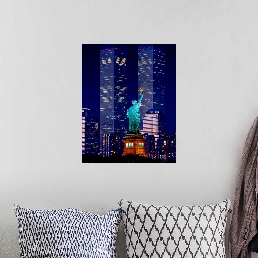 A bohemian room featuring New York City, Statue of Liberty and World Trade Center at night