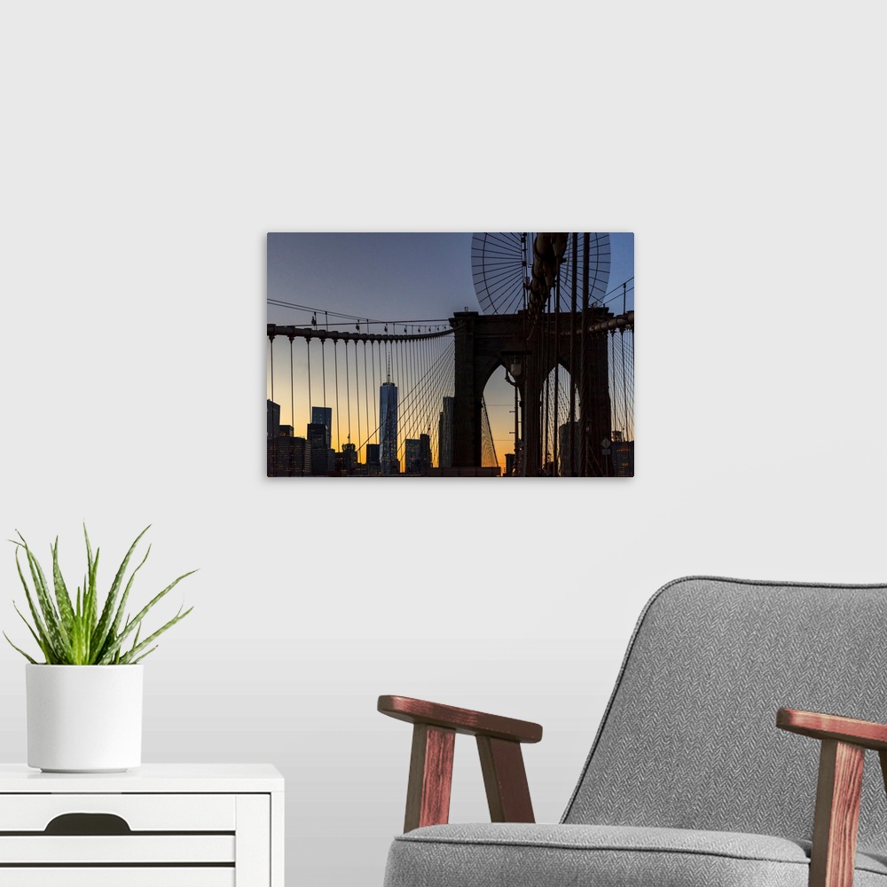 A modern room featuring New York, New York City, Brooklyn Bridge tower and cables..