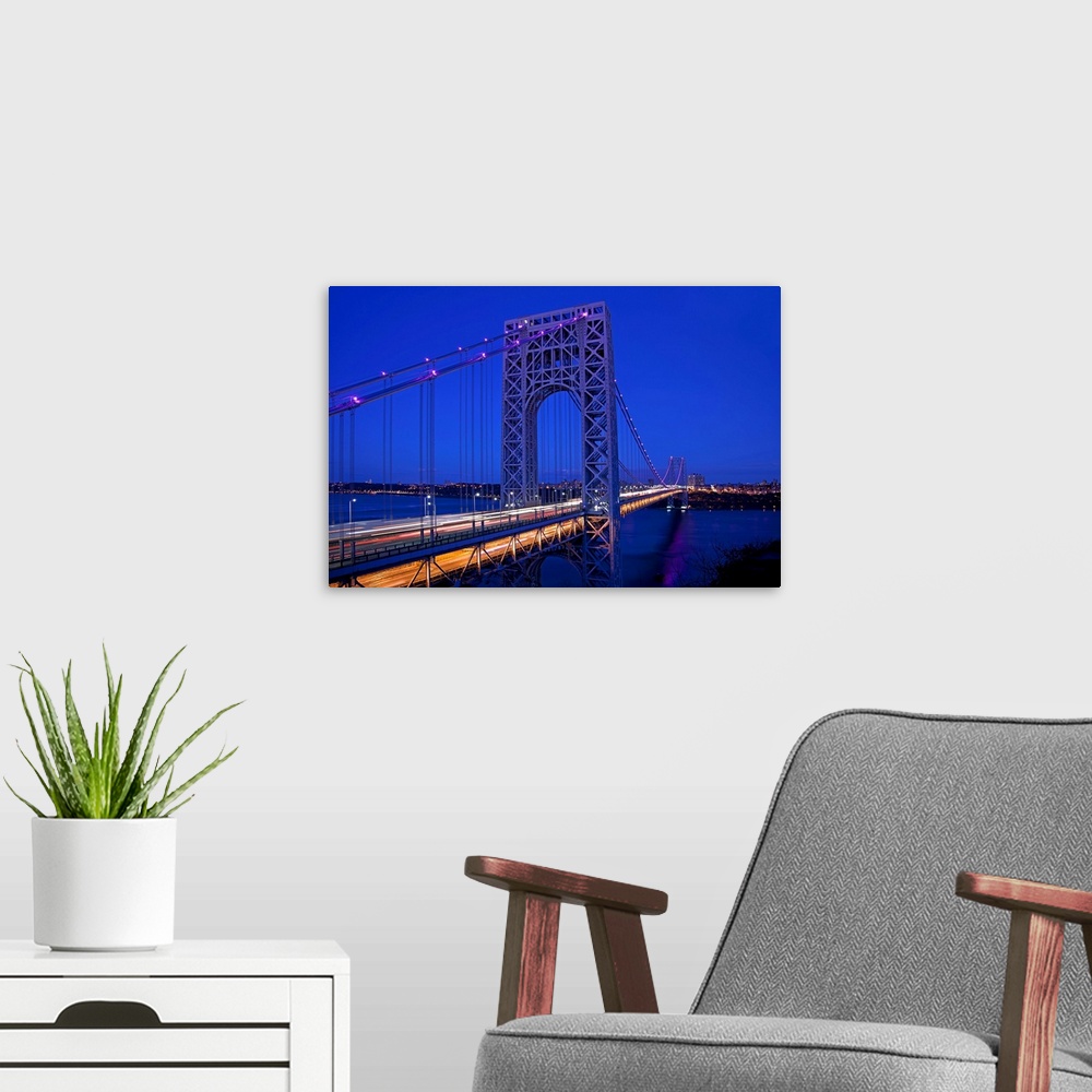 A modern room featuring New York, NYC, George Washington Bridge, view from New Jersey at night