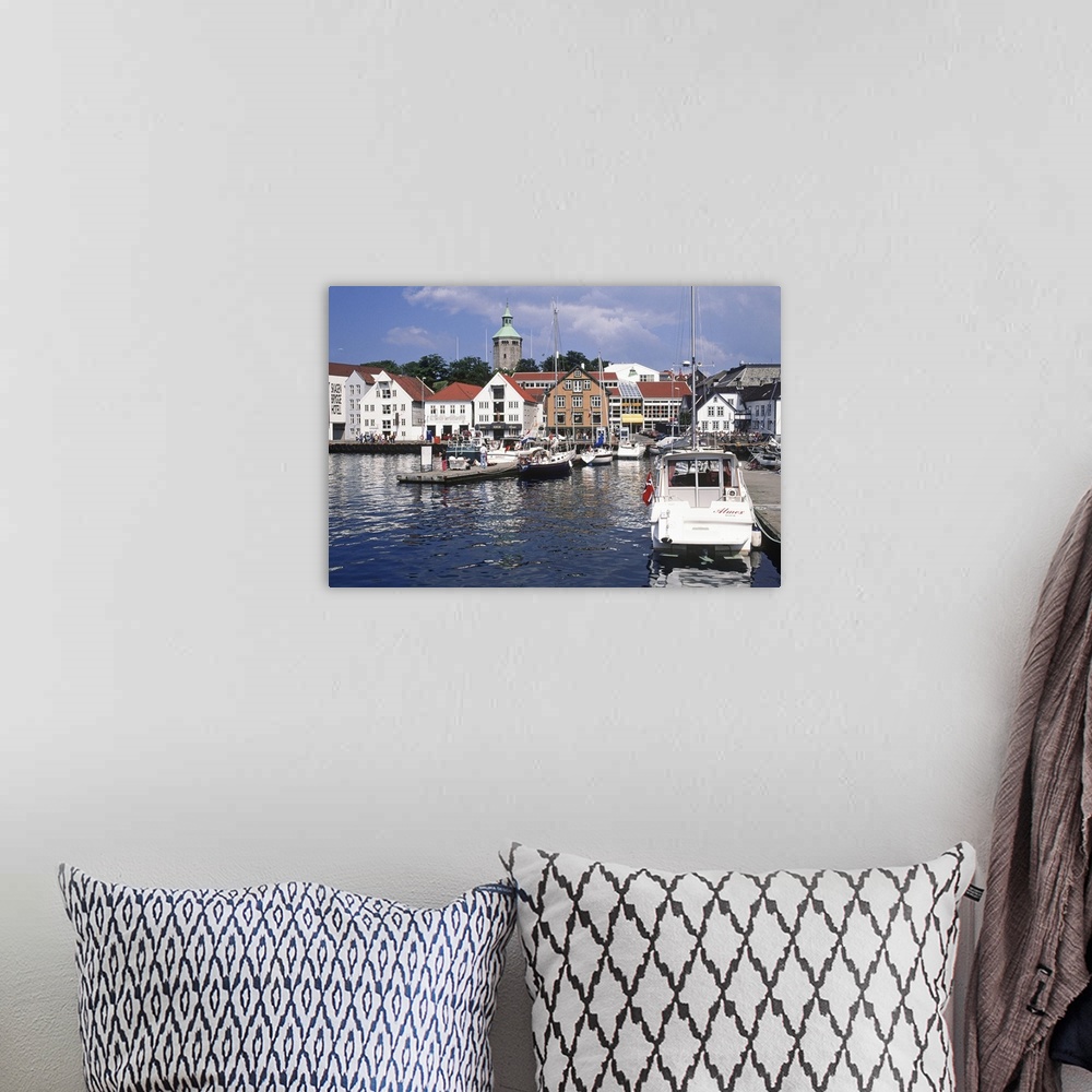 A bohemian room featuring Norway, Rogaland, View of the harbour with the restored old fish warehouses