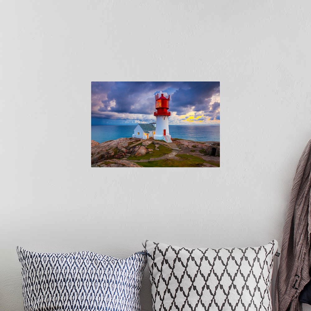 A bohemian room featuring Norway, Vest-Agder, Lindesnes, Lindesnes Fyr Lighthouse at sunset.