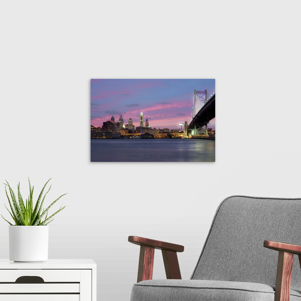 A modern room featuring USA, Pennsylvania, Philadelphia, Philadelphia's skyline over Delaware River.