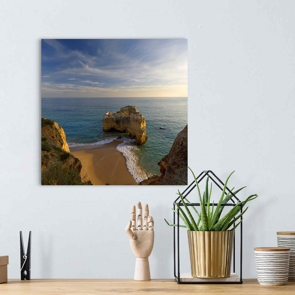 A bohemian room featuring Portugal, Faro, Algarve, Praia da Rocha, Rock formations on an empty beach