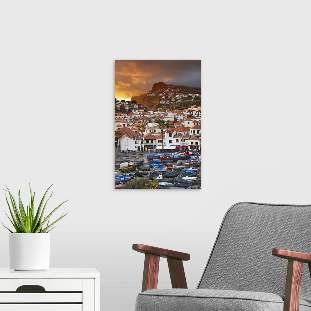A modern room featuring Portugal, Madeira, Camara de Lobos at sunset.