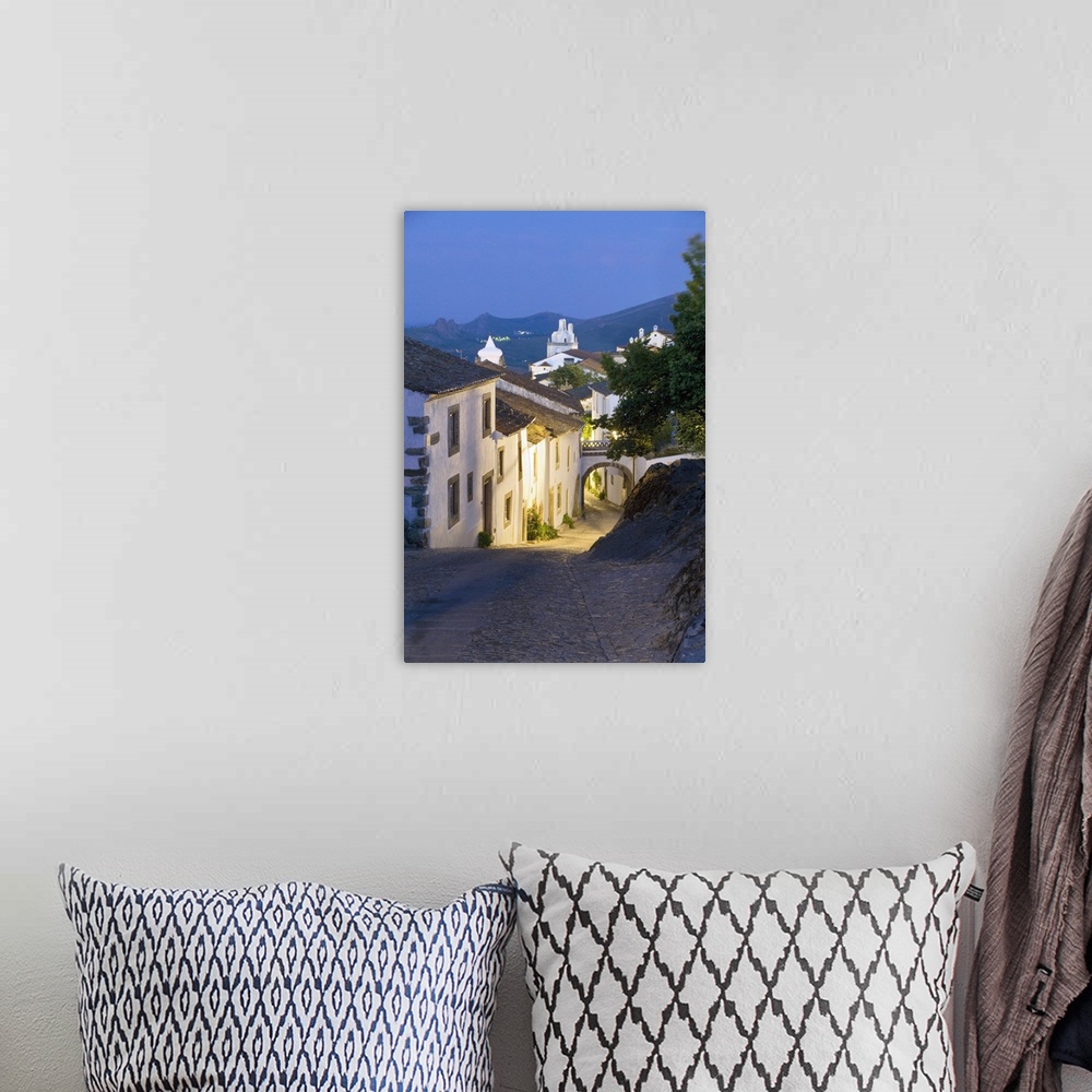 A bohemian room featuring Portugal, Portalegre, Medieval town of Marvao street scene at night