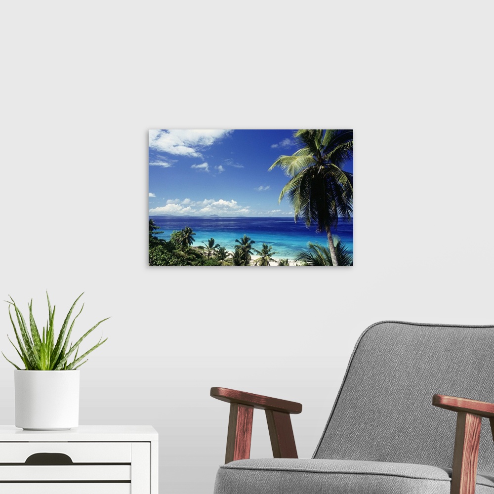 A modern room featuring Seychelles, Fregate, Fregate Island, palms and sea.