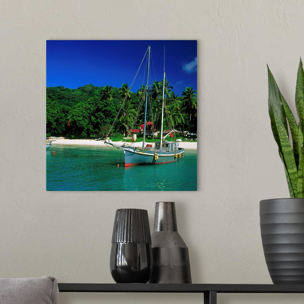 A modern room featuring Seychelles, La Digue, sailing boat in the small harbor