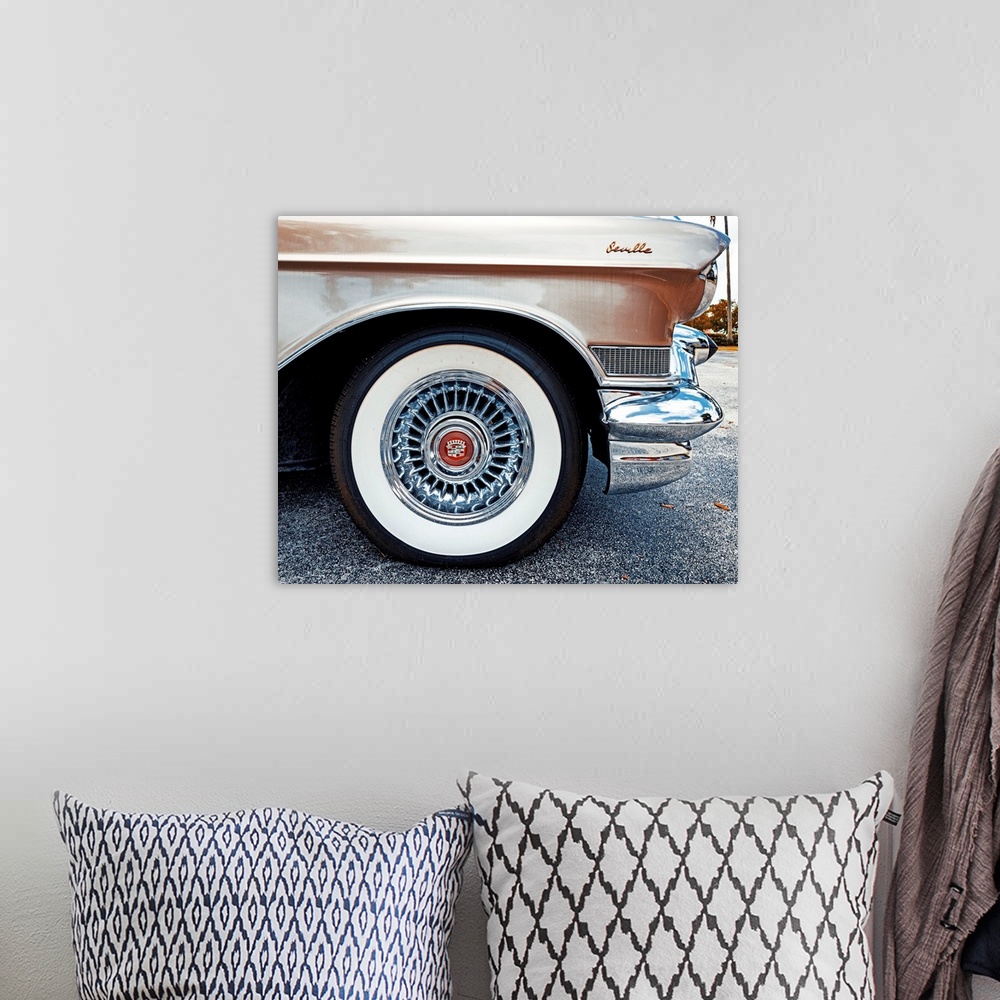 A bohemian room featuring Side view of a 1950's Cadillac Seville.