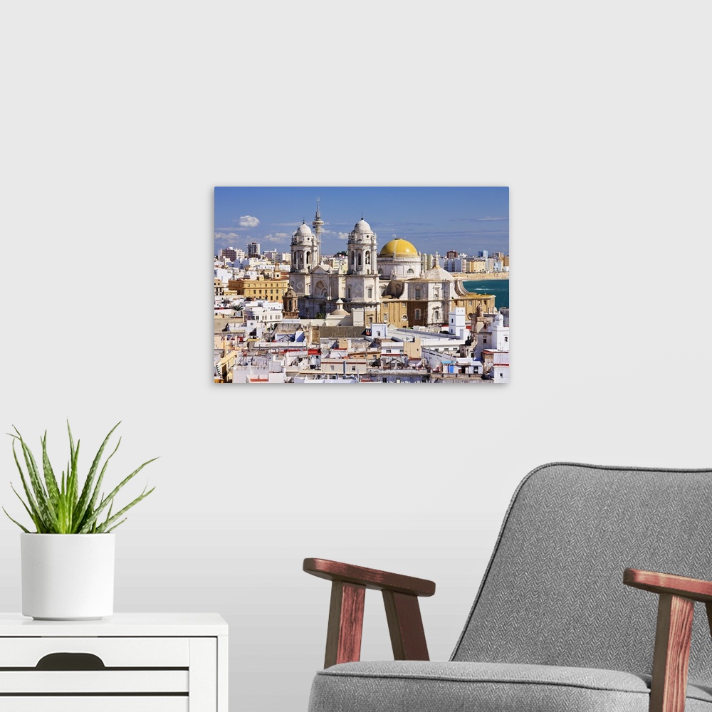 A modern room featuring Spain, Andalusia, Costa de la Luz, Cadiz, Panoramic view of the old town and Cathedral
