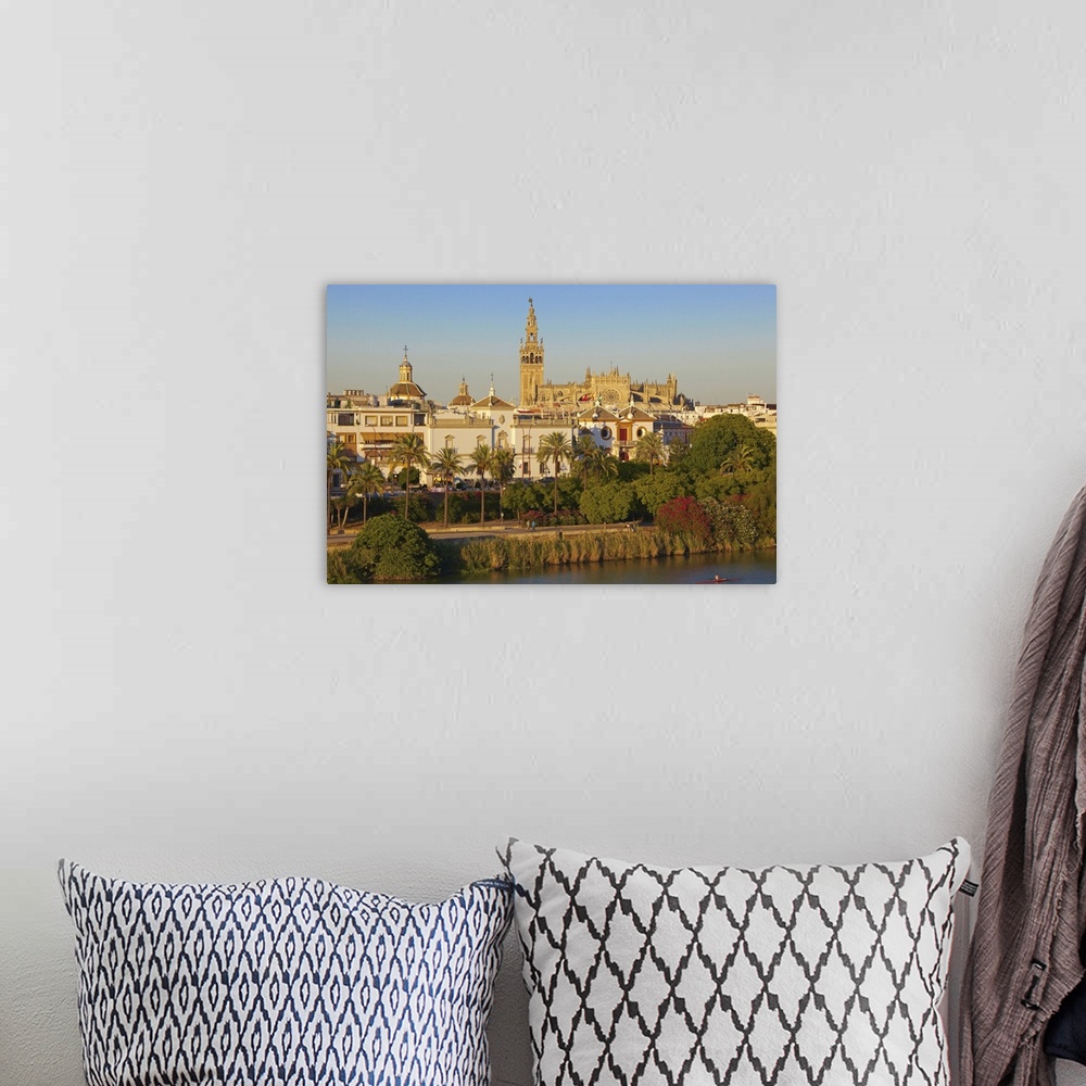 A bohemian room featuring Spain, Andalusia, Mediterranean area, Seville, Guadalquivir river with the Cathedral in background