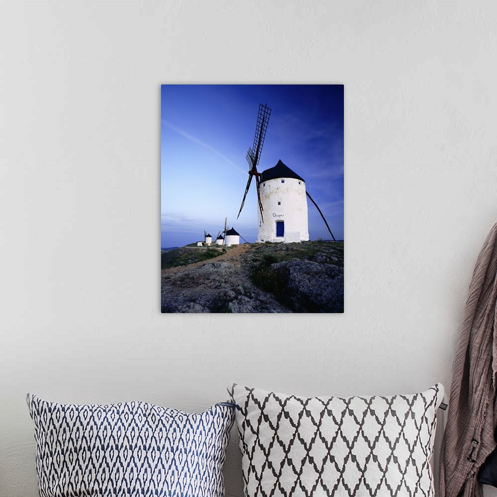 A bohemian room featuring Spain, Castilla-La Mancha, Consuegra, windmills near the village