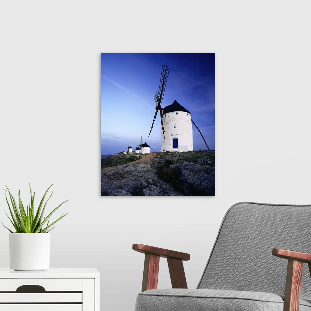 A modern room featuring Spain, Castilla-La Mancha, Consuegra, windmills near the village